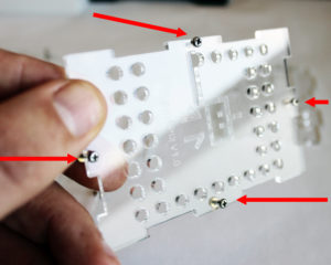 Step 2 - Attach the small screws and nut