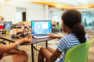 Girl in classroom and GoPiGo - Raspberry Pi Networking in a Classroom